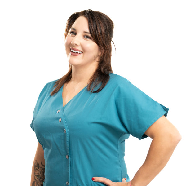 Kerstin Assistenz Kerstin in petrolfarbenem Kittel und strahlendem Lächeln
